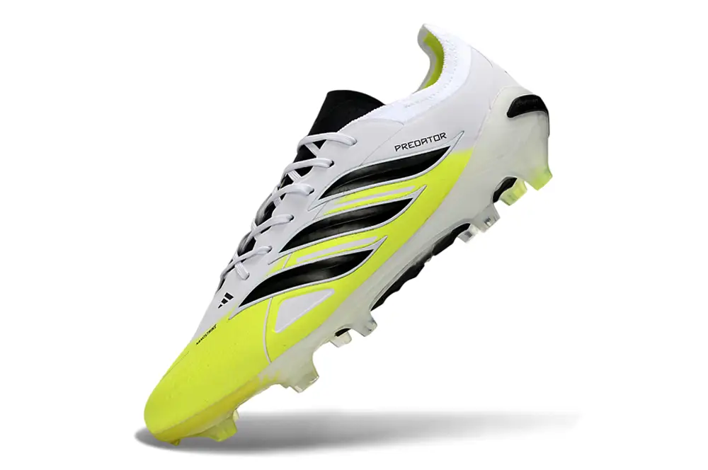 Close-up of Adidas Predator 26 Elite FG football boot's stud pattern and lacing system