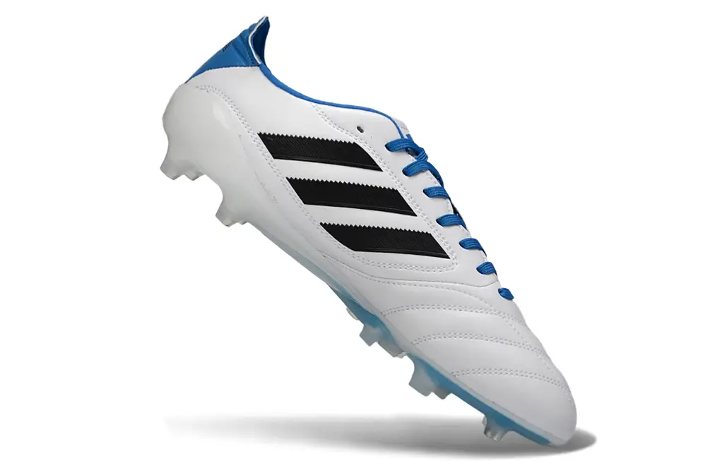 Soccer player wearing Adidas Copa Icon II Elite FG cleats, showcasing agility and speed on the field
