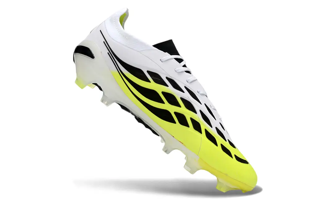 Adidas Predator 26 Elite FG football boot in action on a grass field